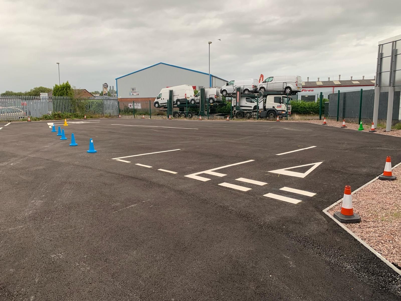 A parking lot with a lot of trucks parked in it