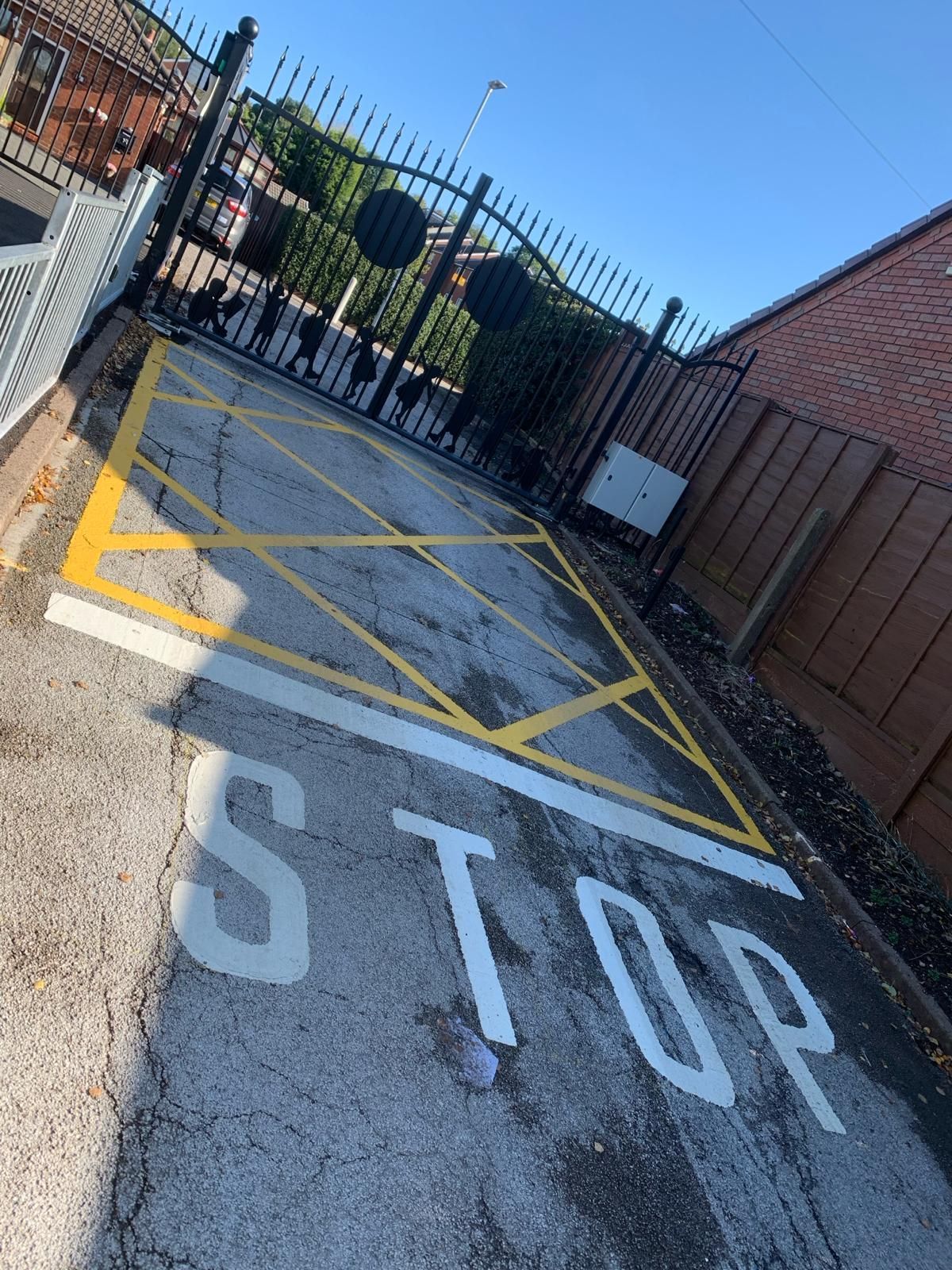 A stop sign is painted on the side of a road.
