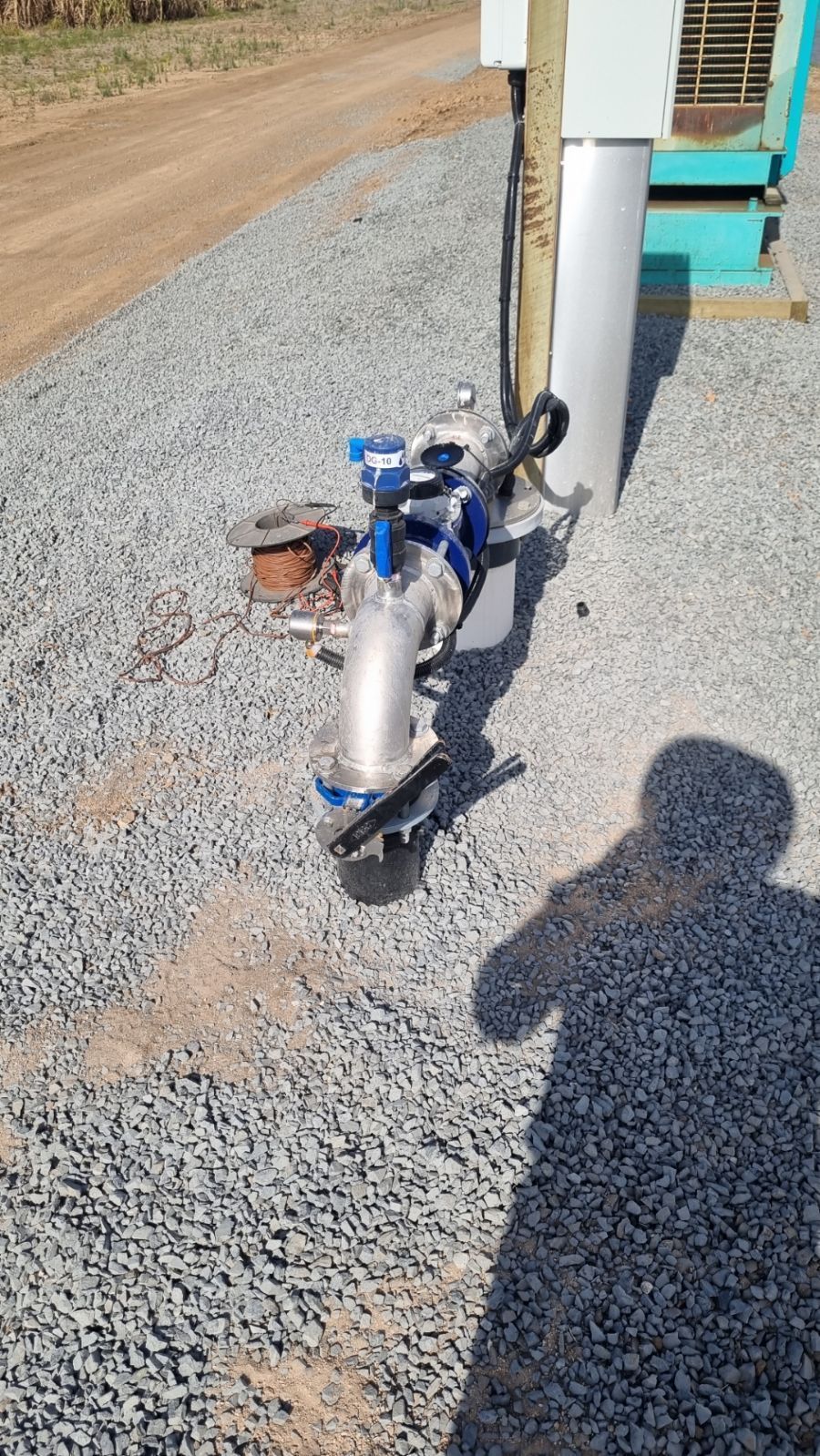 Blue and Silver Water Valve Assembly on Gravel — Wilson's Drilling in South Kolan, QLD