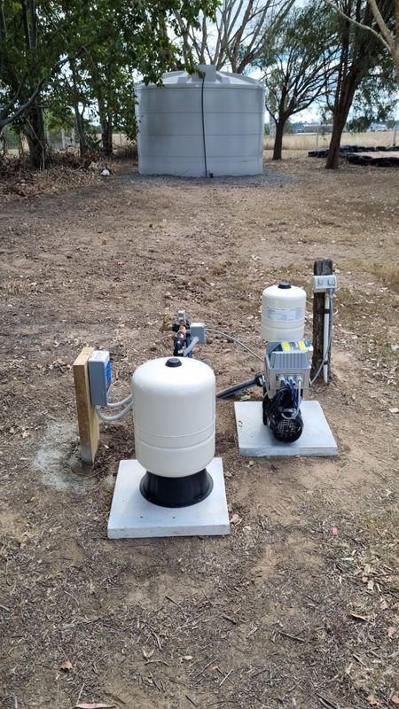 Water Well Components With Tank in Background — Wilson's Drilling in South Kolan, QLD