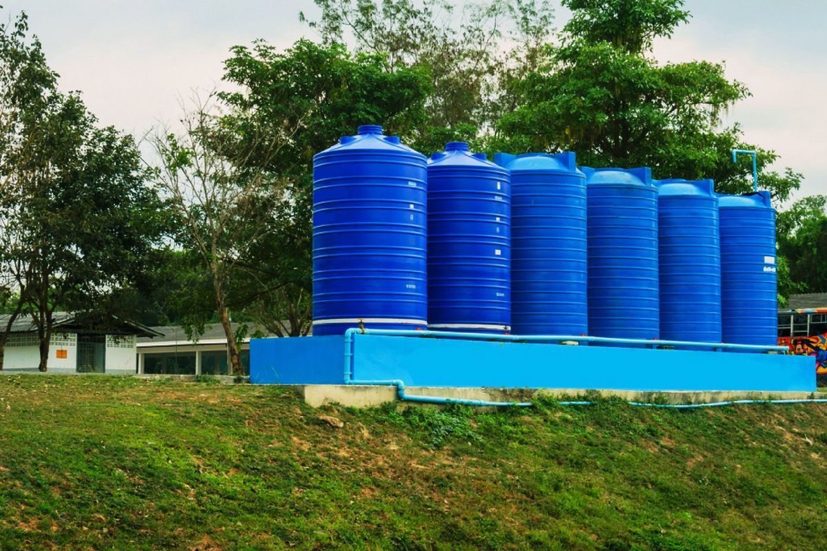 Blue Water Storage Tanks on a Blue Platform — Wilson's Drilling in South Kolan, QLD