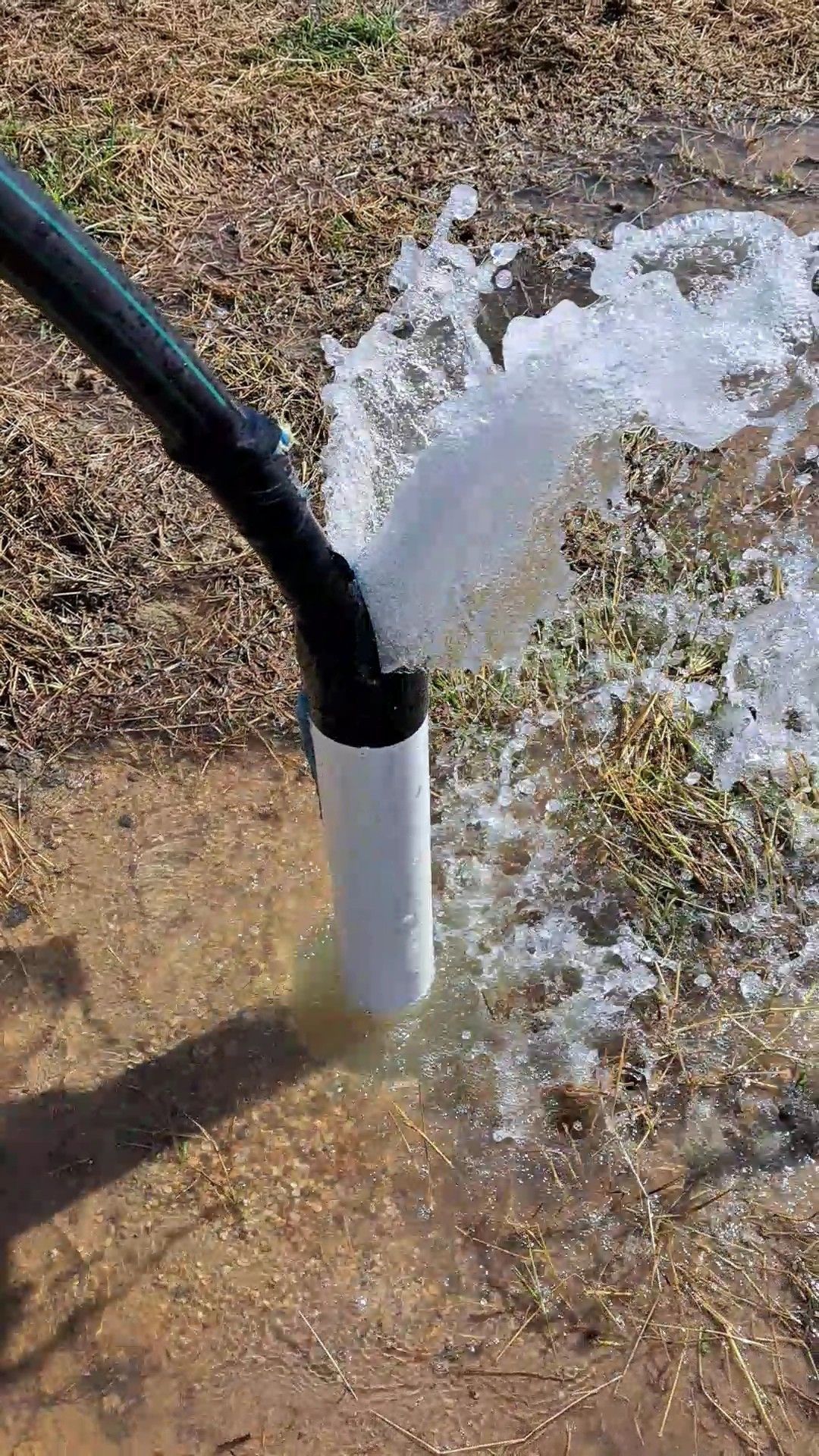 Water Gushing From a White Pipe and Black Connector — Wilson's Drilling in South Kolan, QLD
