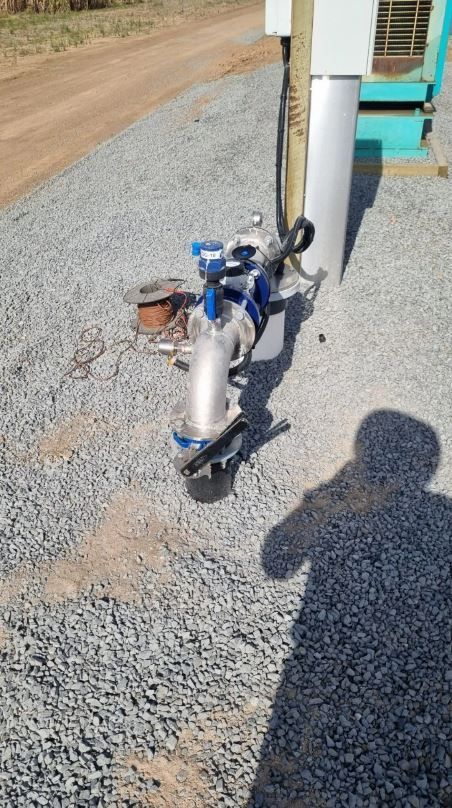 Pipe and Valve Assembly on Gravel Ground, Near a Utility Box — Wilson's Drilling in South Kolan, QLD