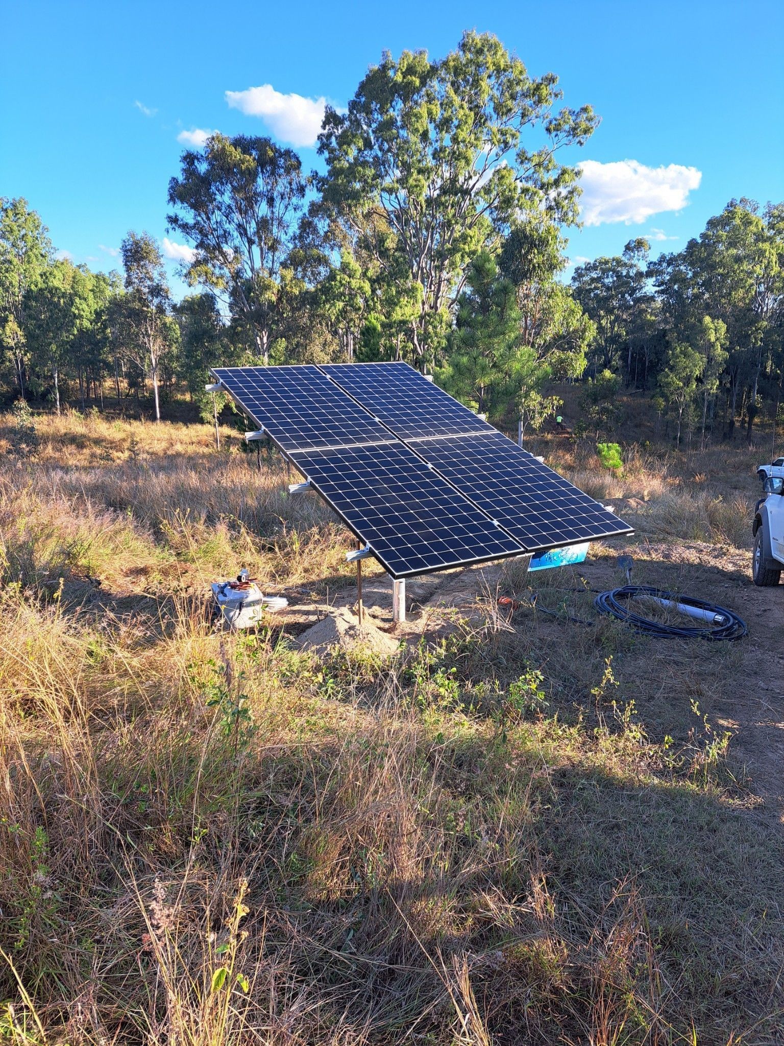 Solar Panel Array in a Field of Dry Grass — Wilson's Drilling in South Kolan, QLD