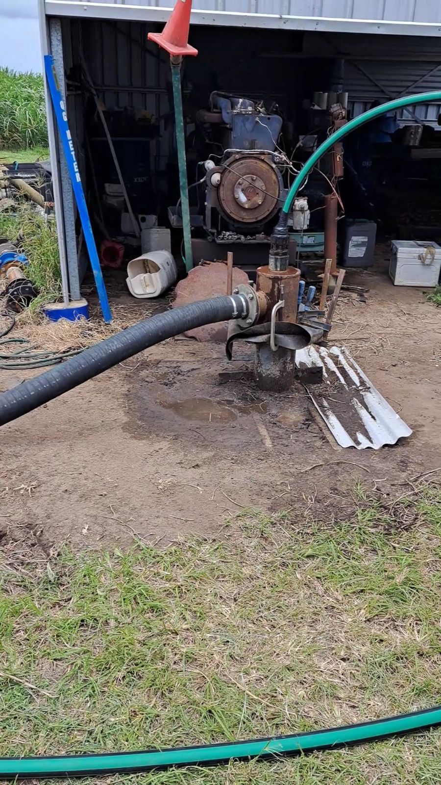 Diesel Water Pump Near a Shed, With Hoses and an Orange Cone — Wilson's Drilling in South Kolan, QLD