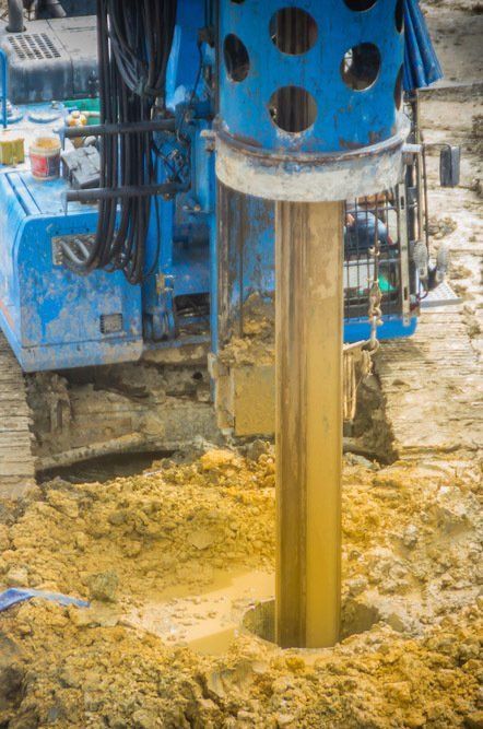 Blue Construction Drill Boring a Hole in Muddy Ground — Wilson's Drilling in South Kolan, QLD