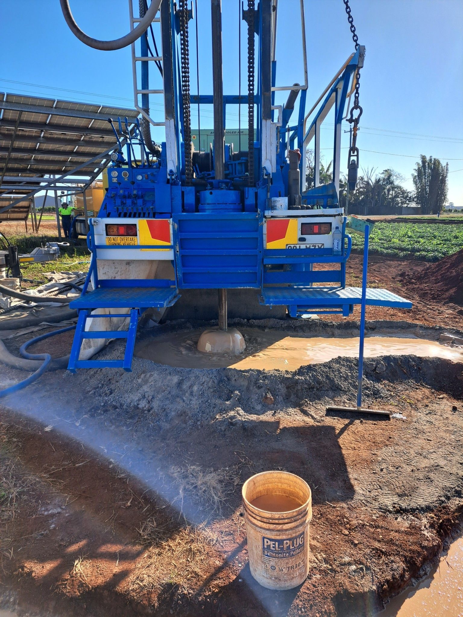 Well Pump System With Blue and Black Pipes — Wilson's Drilling in South Kolan, QLD