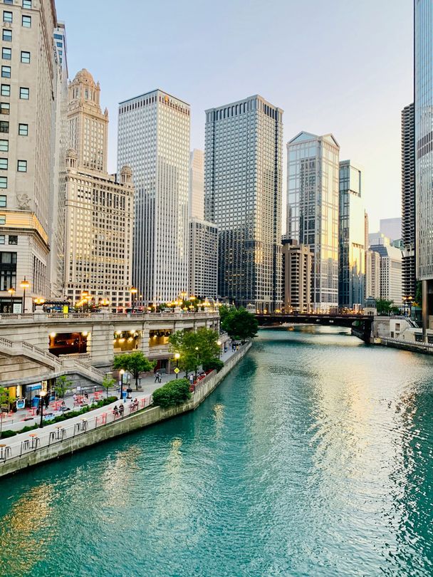 A river runs through a city surrounded by tall buildings