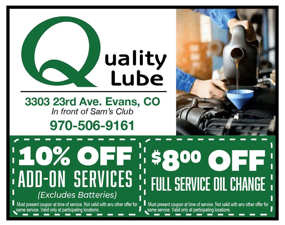 Advertisement for Quality Lube: green logo, address, phone, oil change promotion.