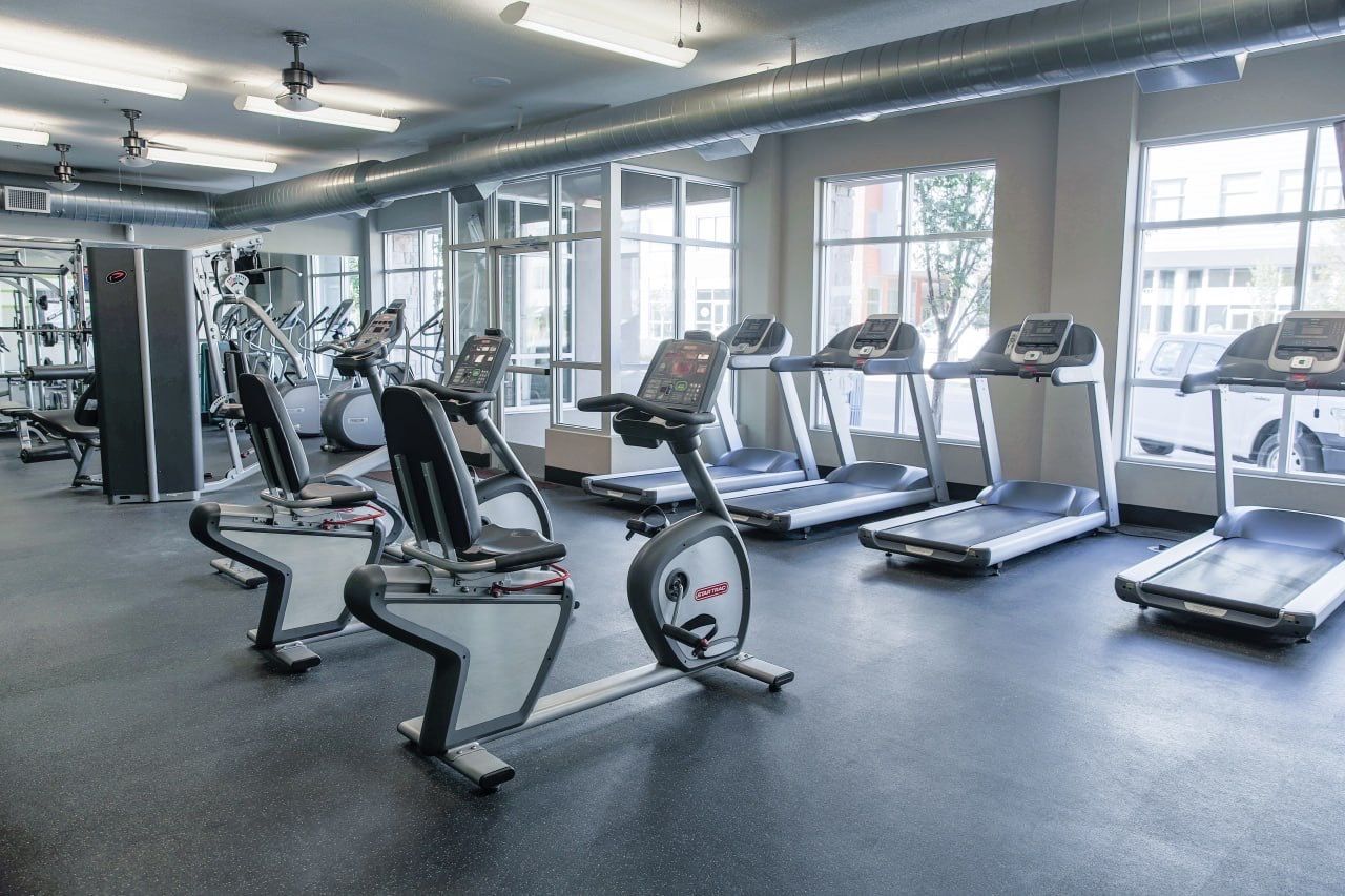 Indoor gym with treadmills and cardio equipment.