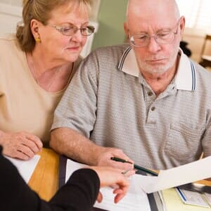 Payroll Accounting — Old Man and Old Lady Reading About Tax Preparation and Planning in Newton, NC