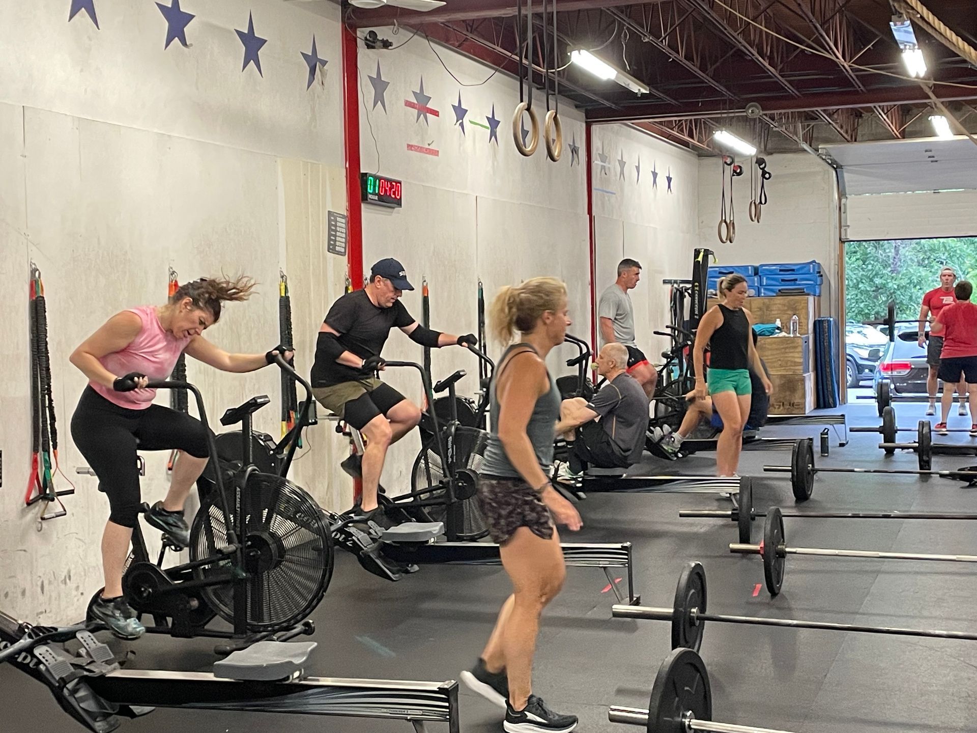 A group of people are working out in a gym.