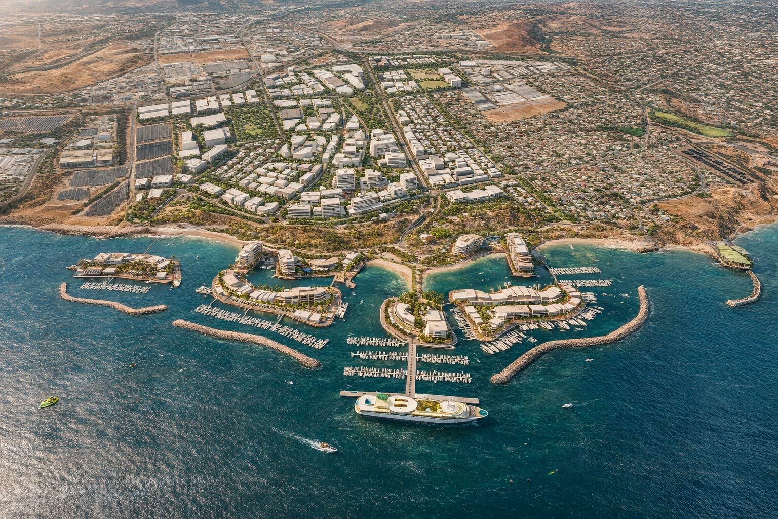 Aerial view of a marina with multiple luxury buildings surrounded by blue ocean water and coastal residential areas.