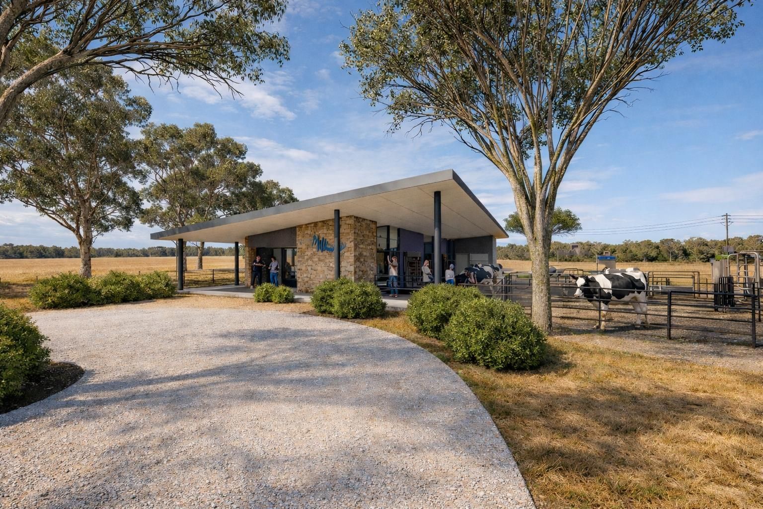 A modern, flat-roofed stone building with a gravel driveway and surrounding trees, featuring a nearby outdoor animal pen.