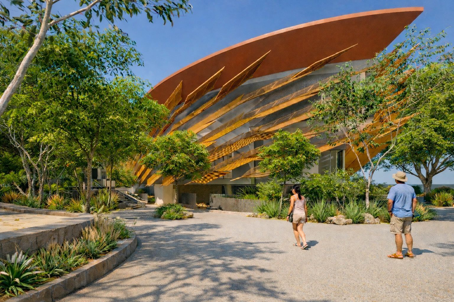 Two people walk on a gravel path toward the Jean-Marie Tjibaou Cultural Center, a building with curved, wooden structures.