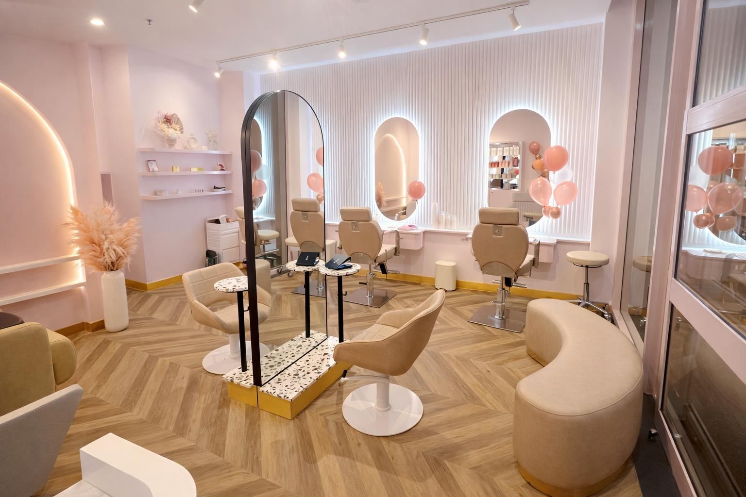 Outdoor pavilion with a curved roof, steel columns, timber-lined ceiling panels, and seating areas 