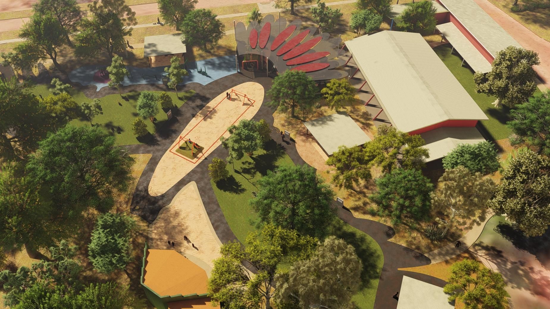 A gravel pathway winds through a sunny park filled with trees, garden beds, and a white, modern shade structure.