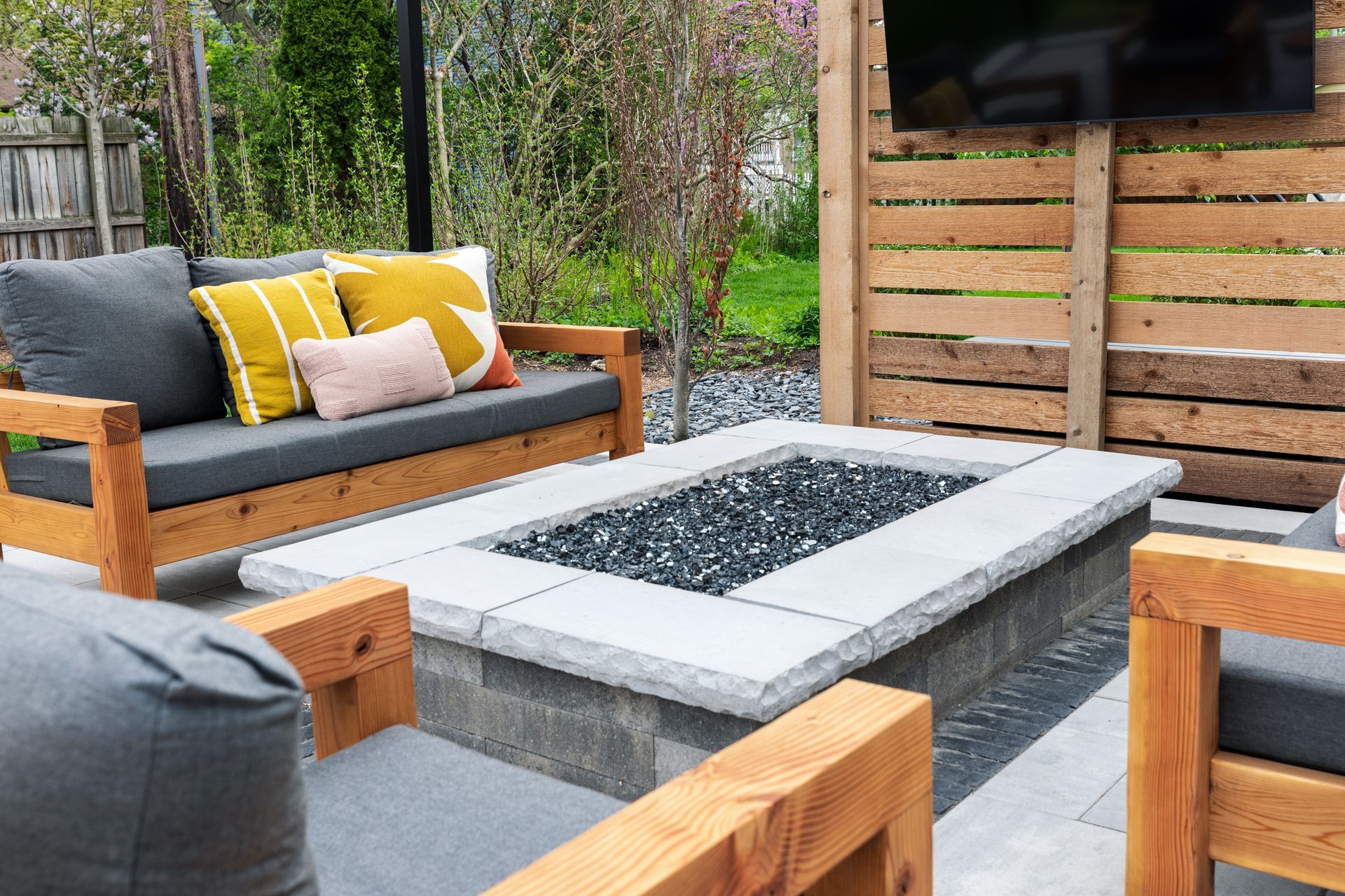 There is a fire pit in the middle of the patio.