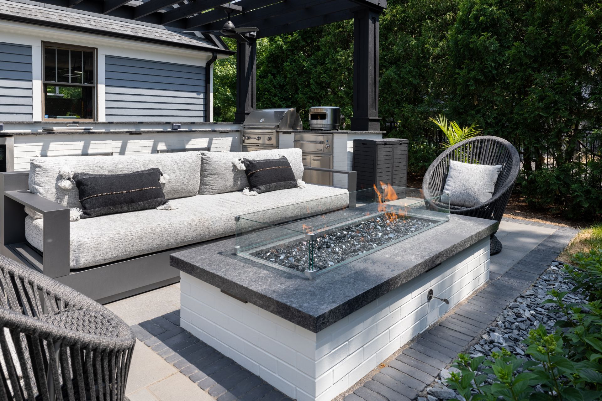 There is a fire pit in the middle of the patio.