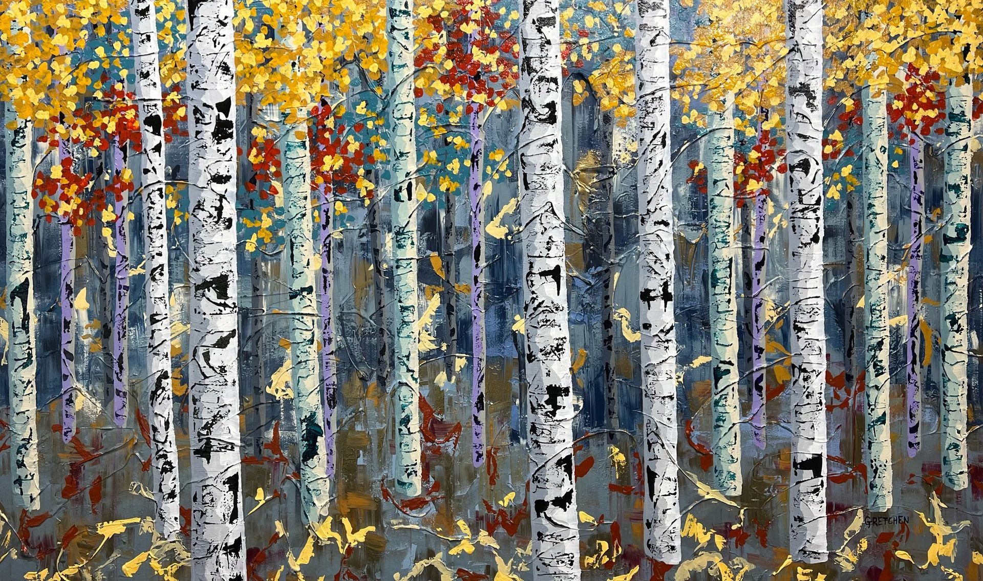 Birch trees with white bark and colorful autumn foliage.
