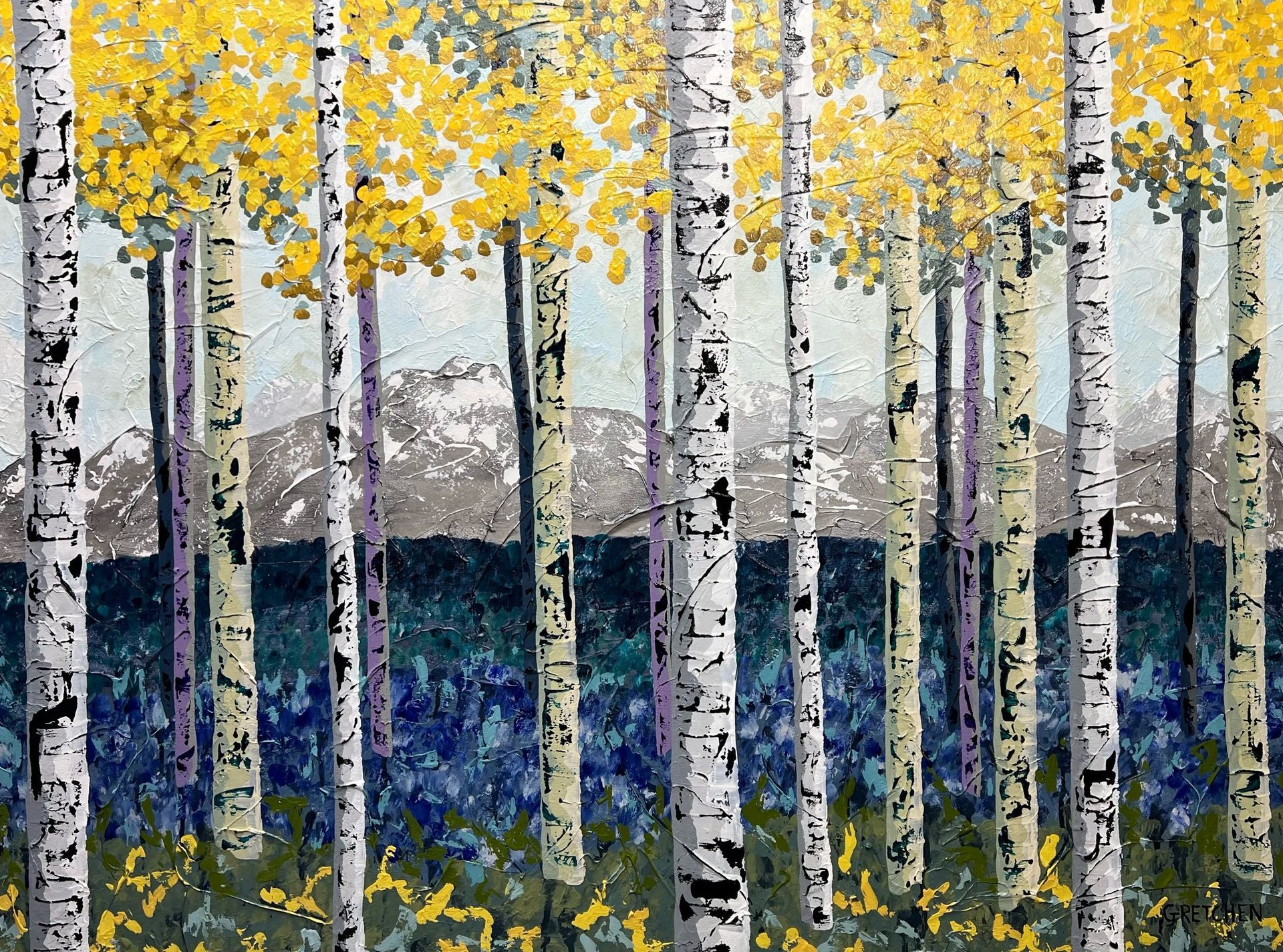 Aspen trees with white bark and yellow leaves in a forest; blue and green undergrowth, gray mountains in background.
