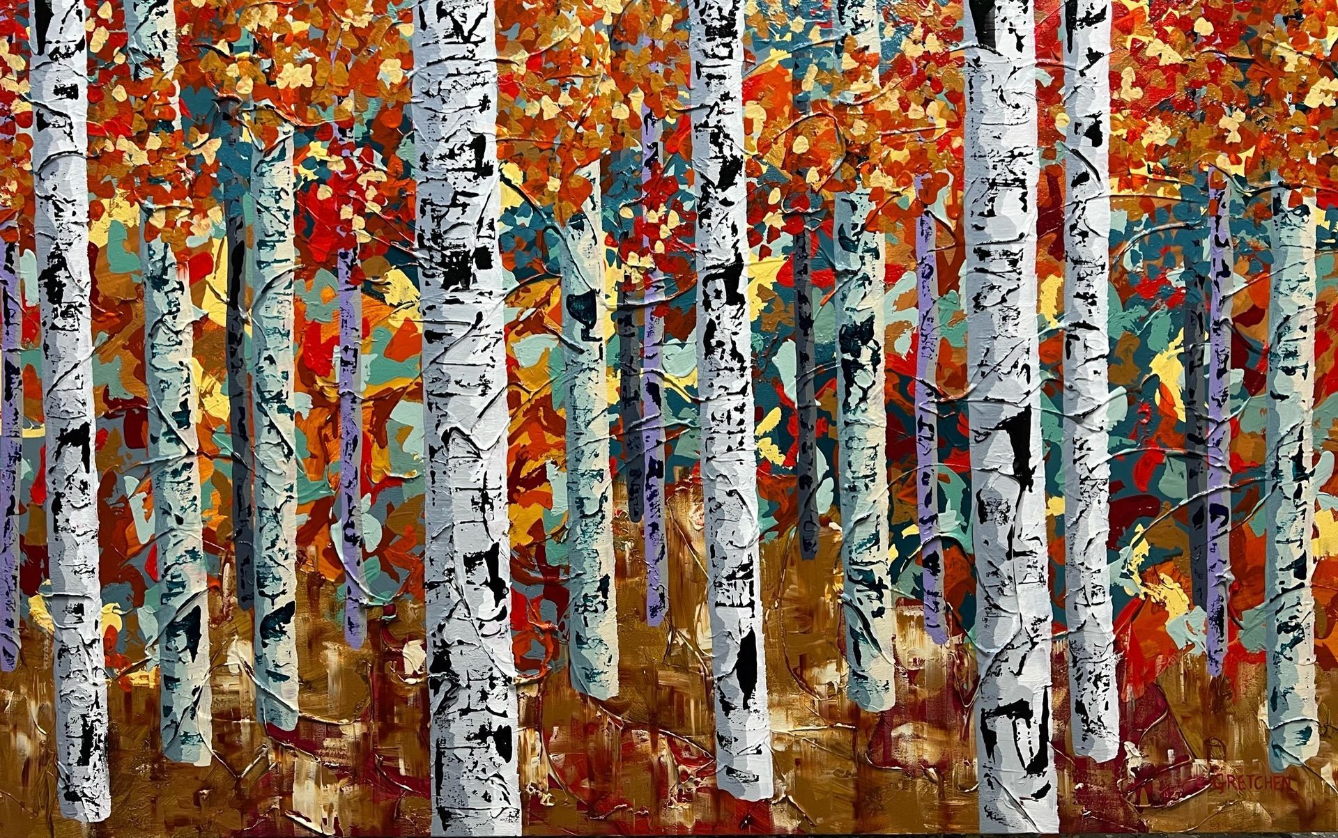 White birch trees with black markings in an autumn forest, colorful leaves.