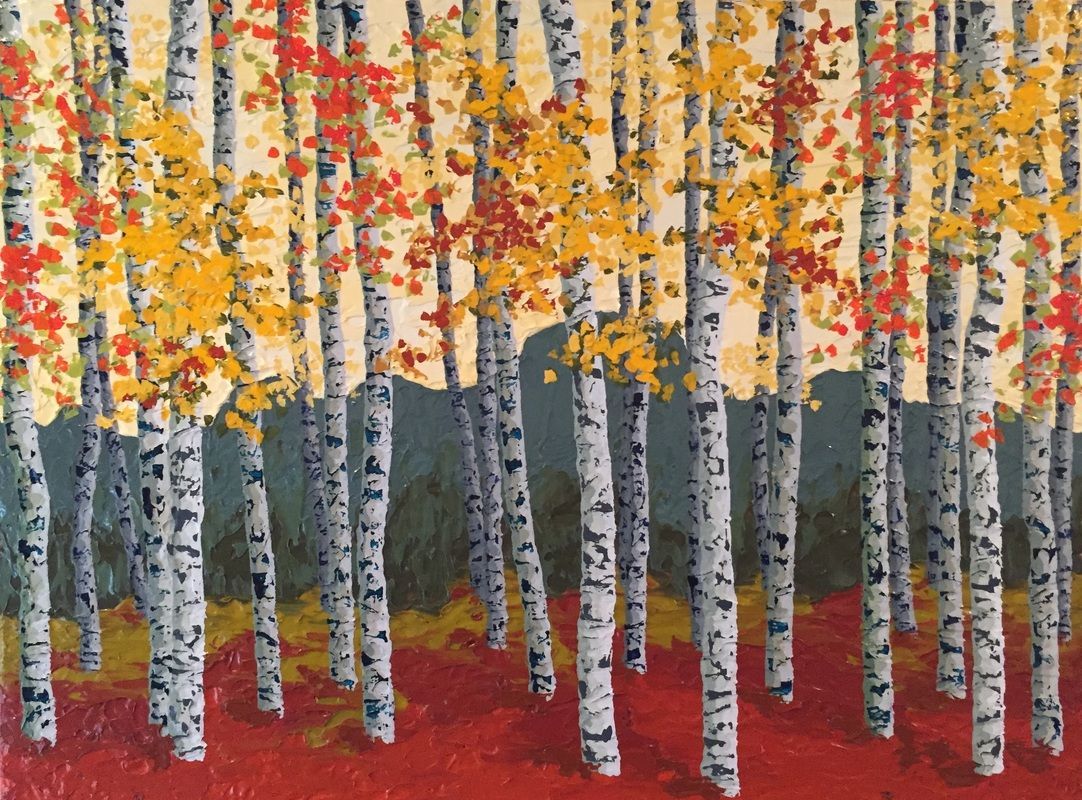 Birch trees in a forest with red, yellow, and orange fall foliage; red ground.