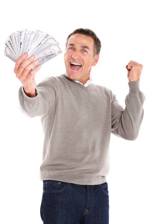 Ecstatic mature guy winning lots of money