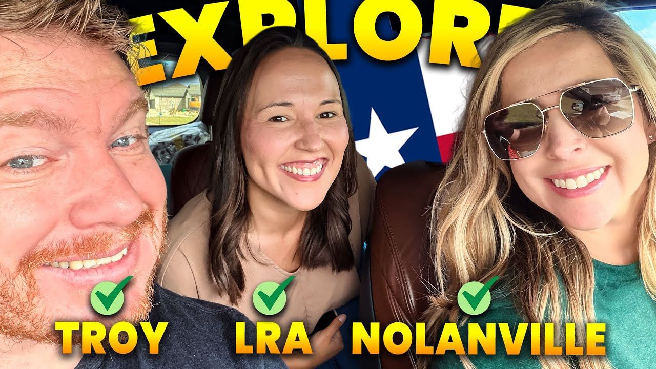 Three smiling people in a car; the man and two women, with a Texas flag behind them.