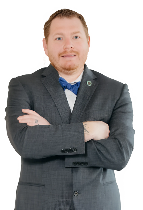 A man in a suit and bow tie with his arms crossed