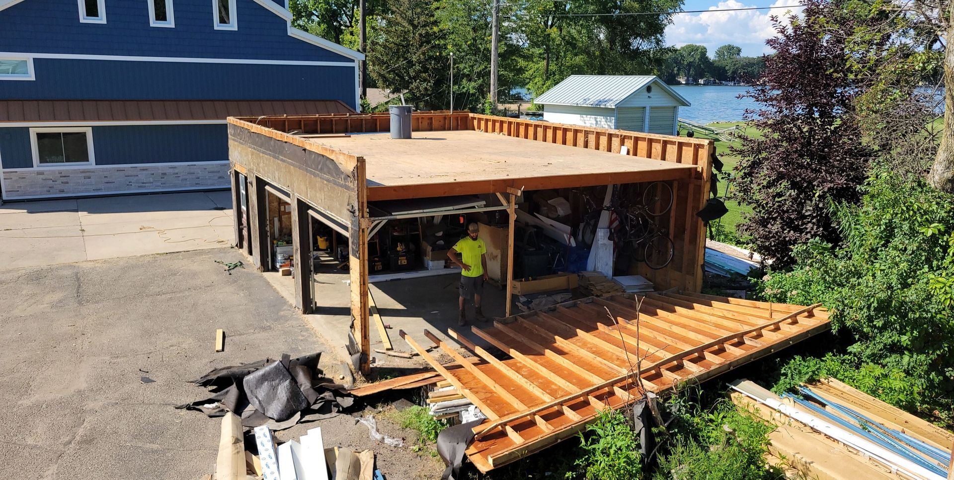 A wooden structure is being built in front of a house.