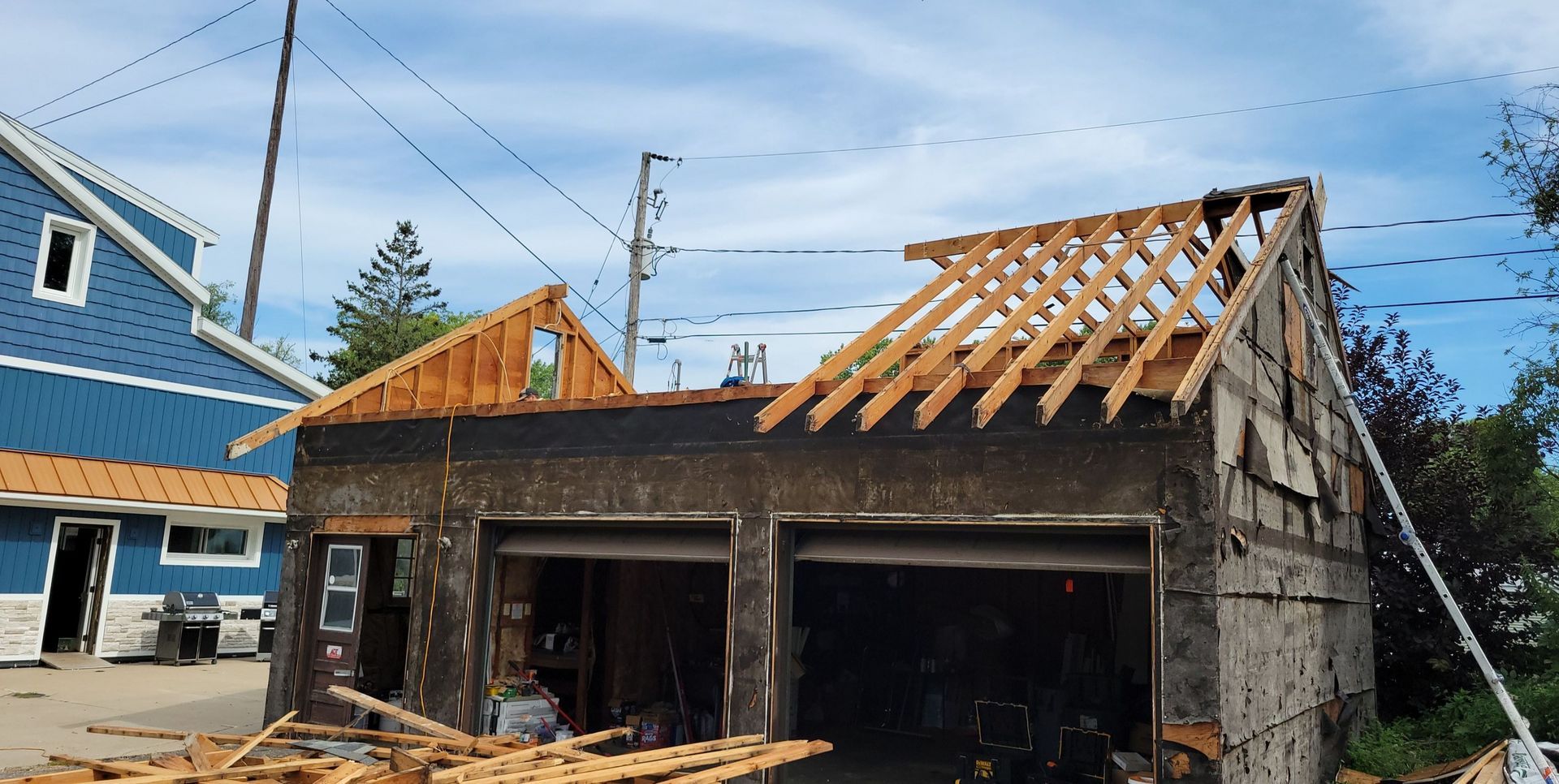 A house is being built with a wooden roof frame.