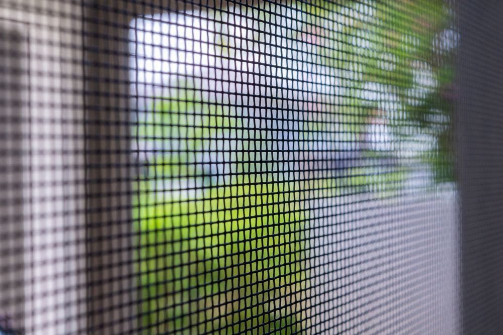 A Close Up Of A Mosquito Screen On A Window — Roo’s Door & Window Maintenance In Sippy Downs, QLD