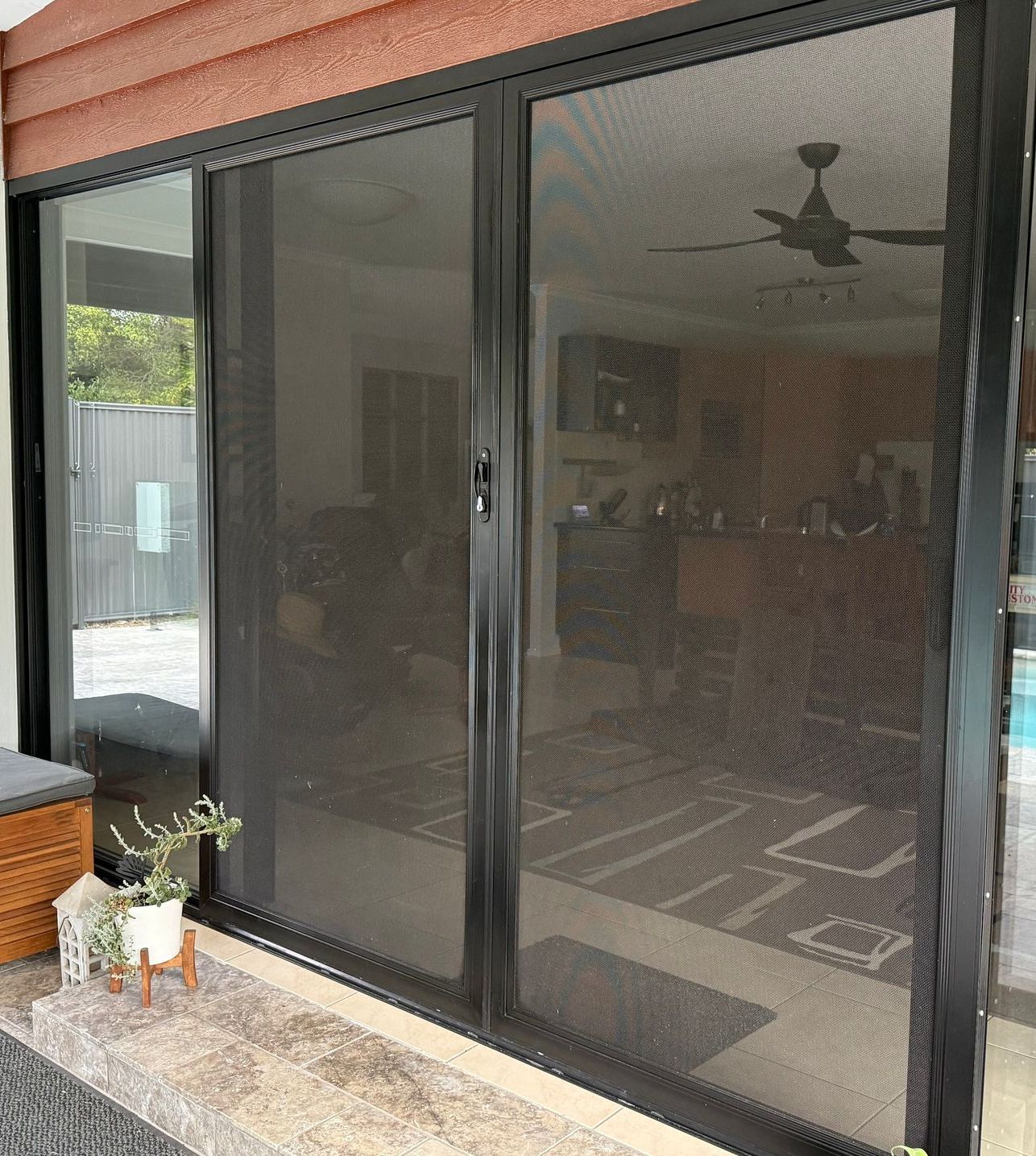 A Close Up Of A Chain Link Fence With A Pattern On It — Roo’s Door & Window Maintenance In Sippy Downs, QLD