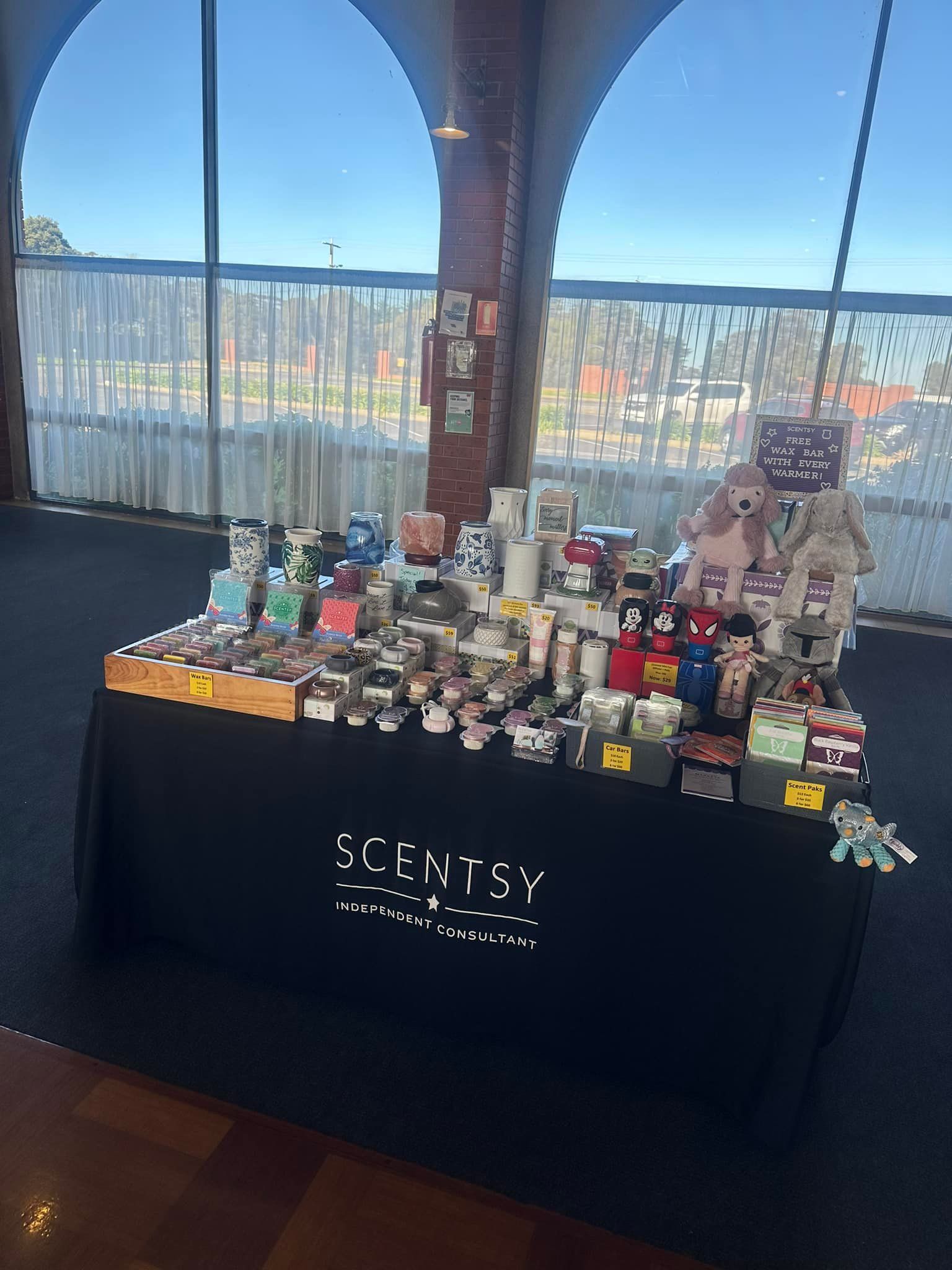 A table filled with lots of colorful cups and candles.