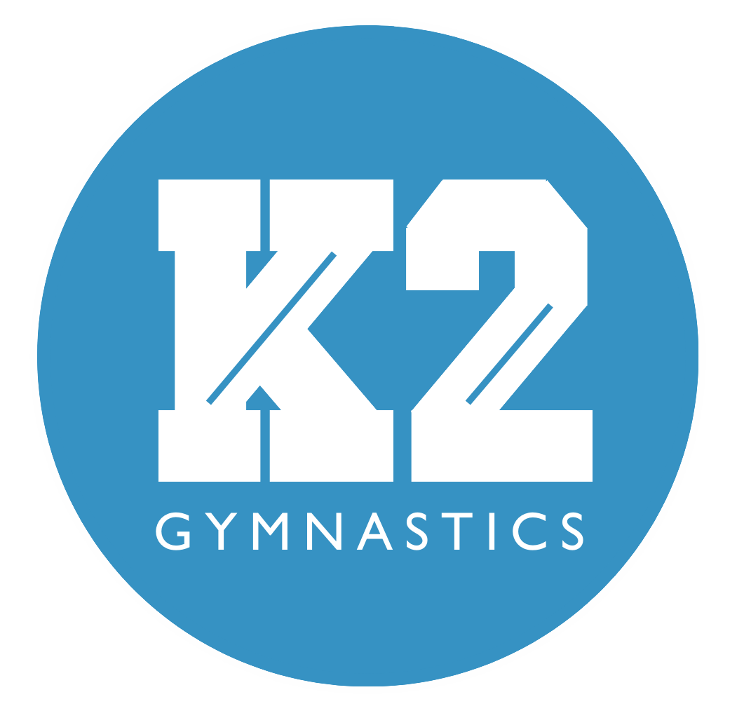 A logo for k2 gymnastics in a blue circle