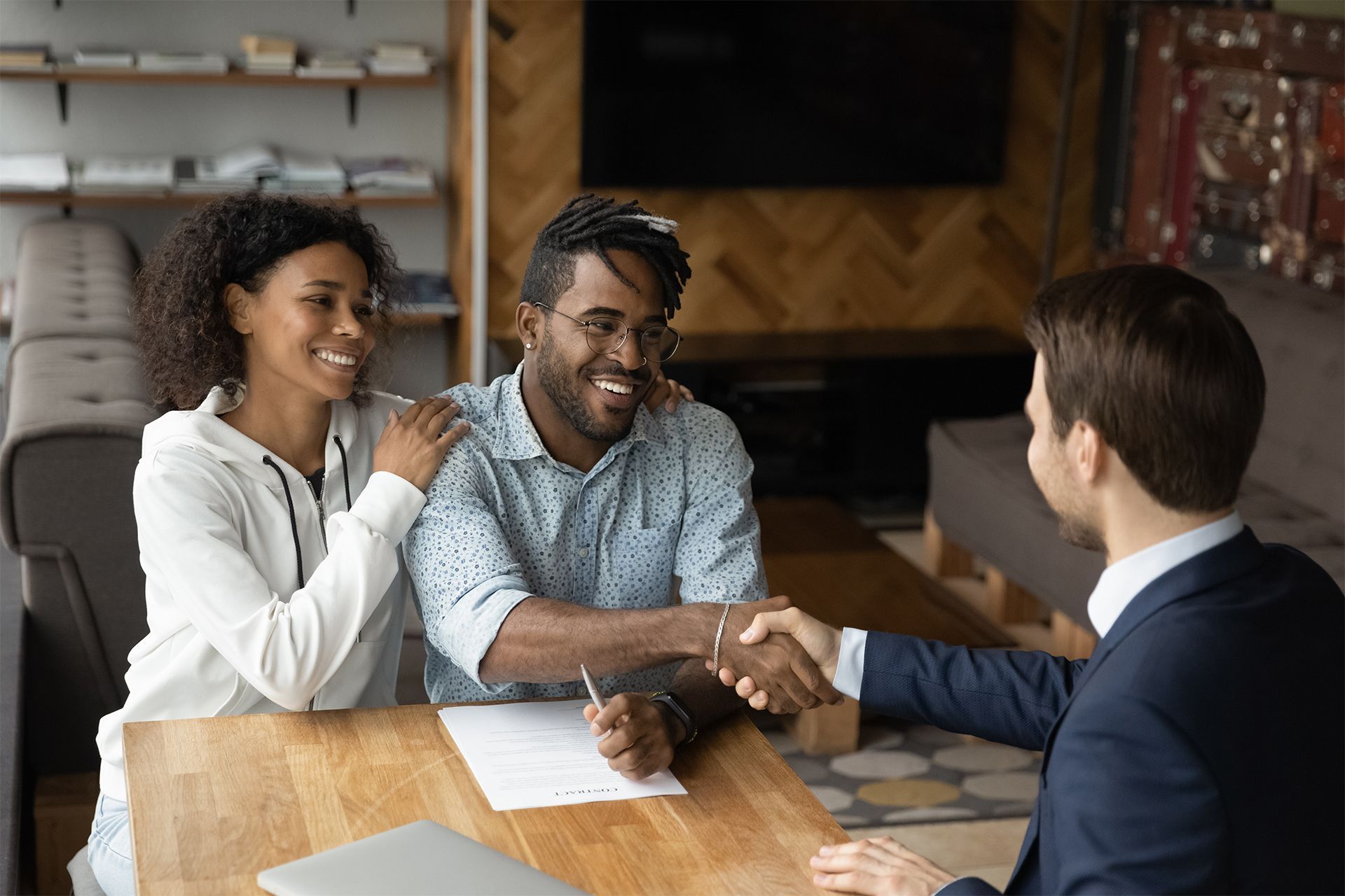 Couple Shaking Hands With the Lender