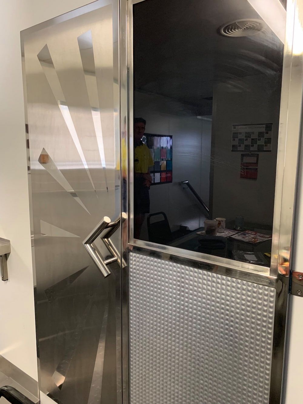 A Man is Standing in a Room Behind a Stainless Steel Door — Metaltrendz in Kunda Park, QLD