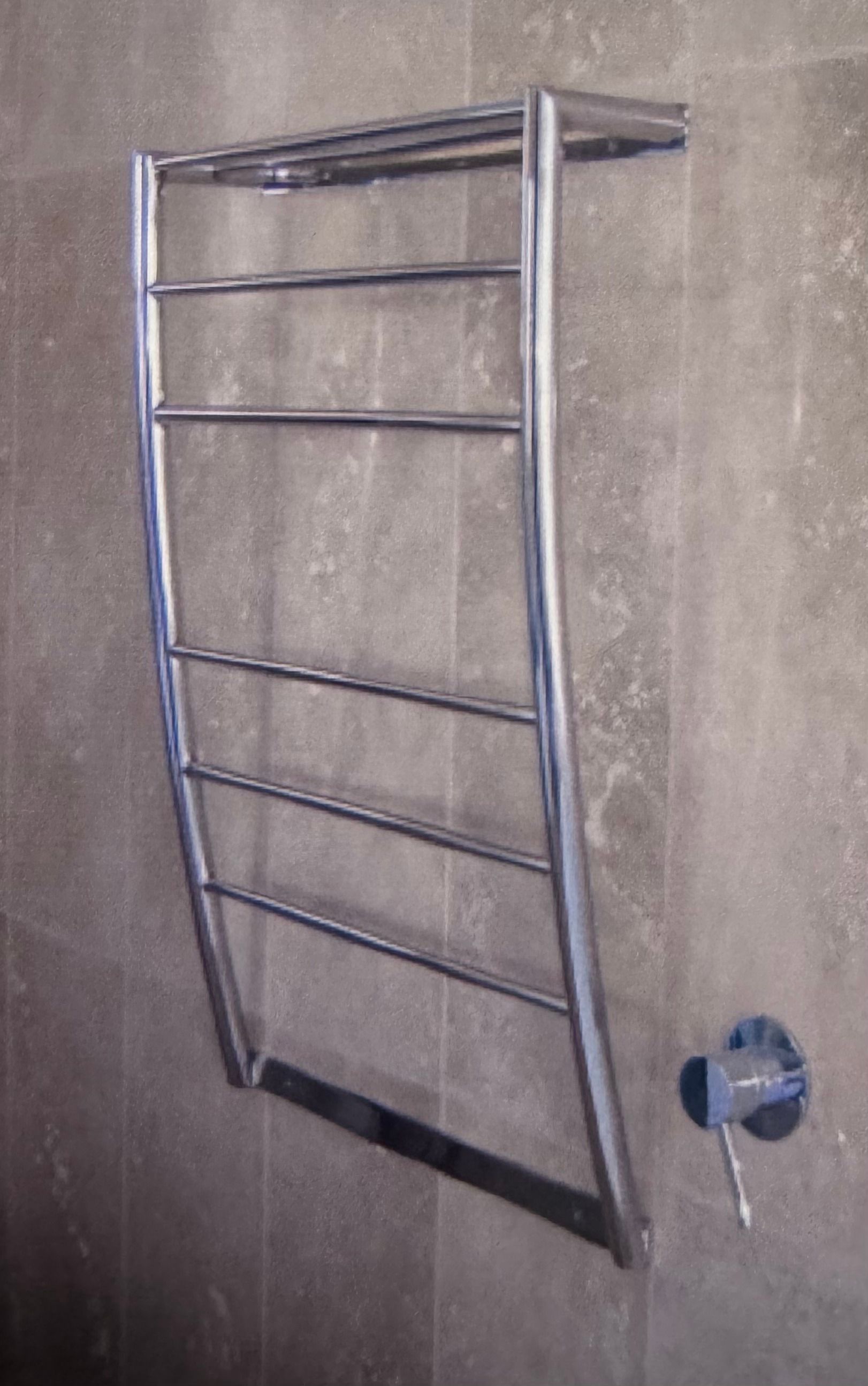 Chrome towel rack mounted on a gray tiled wall — Metaltrendz in Kunda Park, QLD
