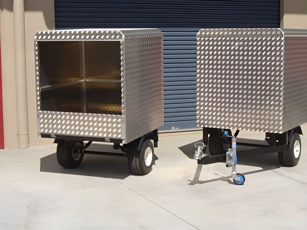 Two Stainless Steel Trailers Are Parked Next to Each Other — Metaltrendz in Coolum Beach, QLD