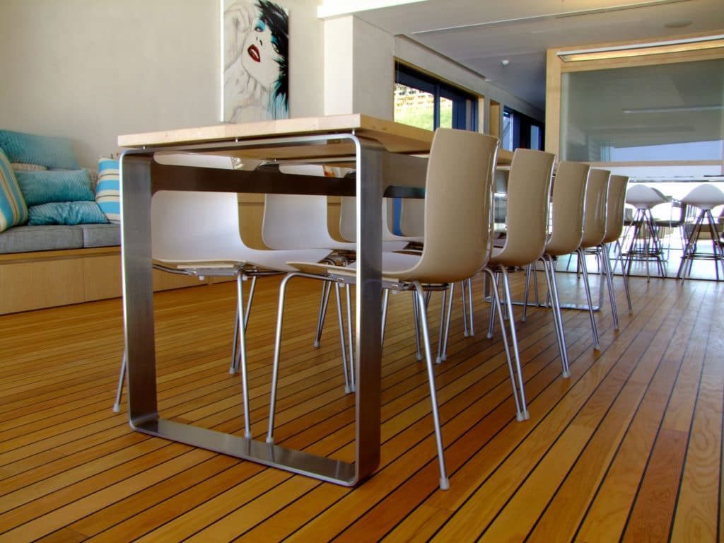 A Dining Room Table and Chairs on a Wooden Floor — Metaltrendz in Kunda Park, QLD
