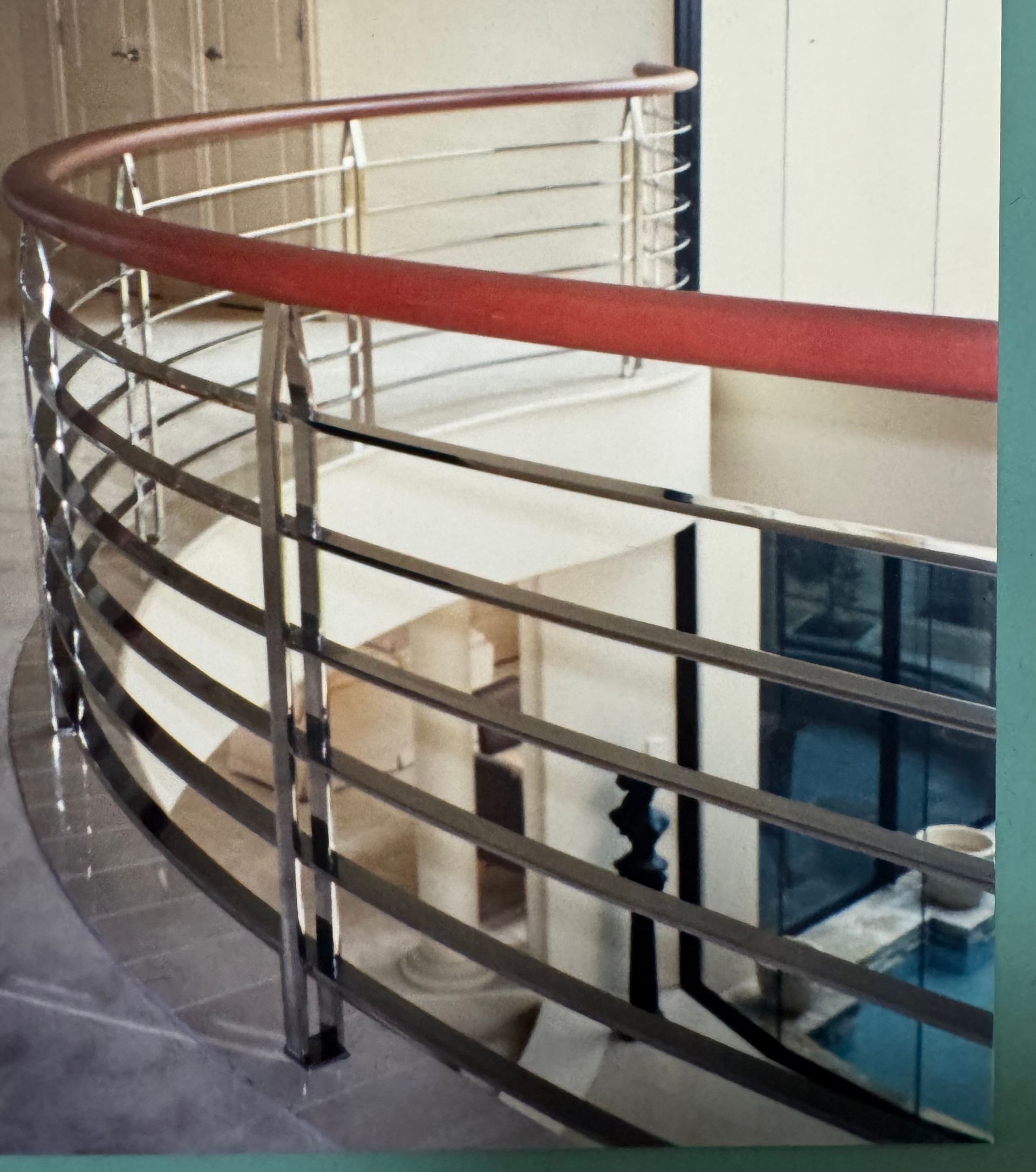 Curved staircase with stainless steel and wooden railing, overlooking a lower level with glass windows — Metaltrendz in Kunda Park, QLD