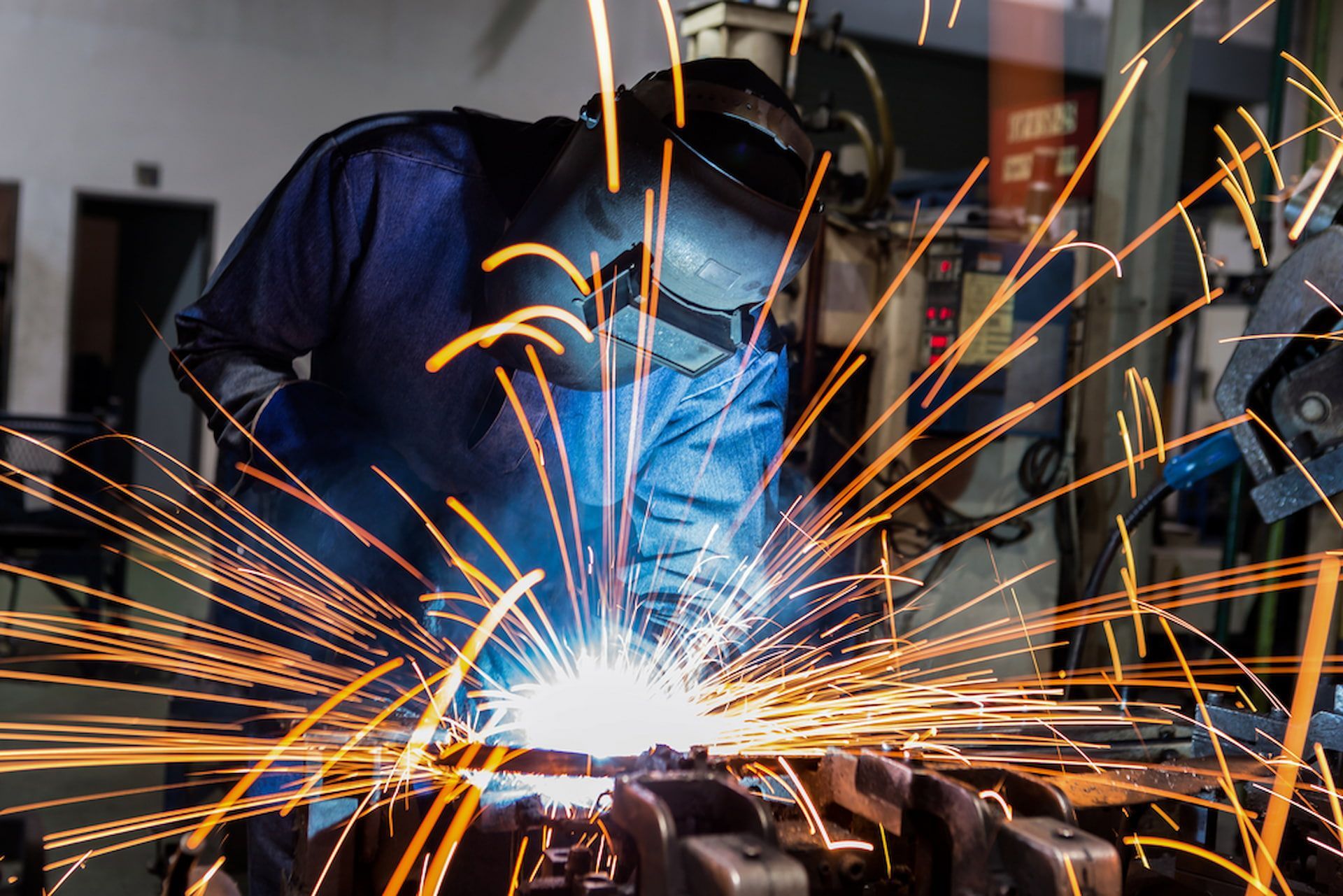 A Man is Welding a Piece of Metal in a Factory — Metaltrendz in Maroochydore, QLD