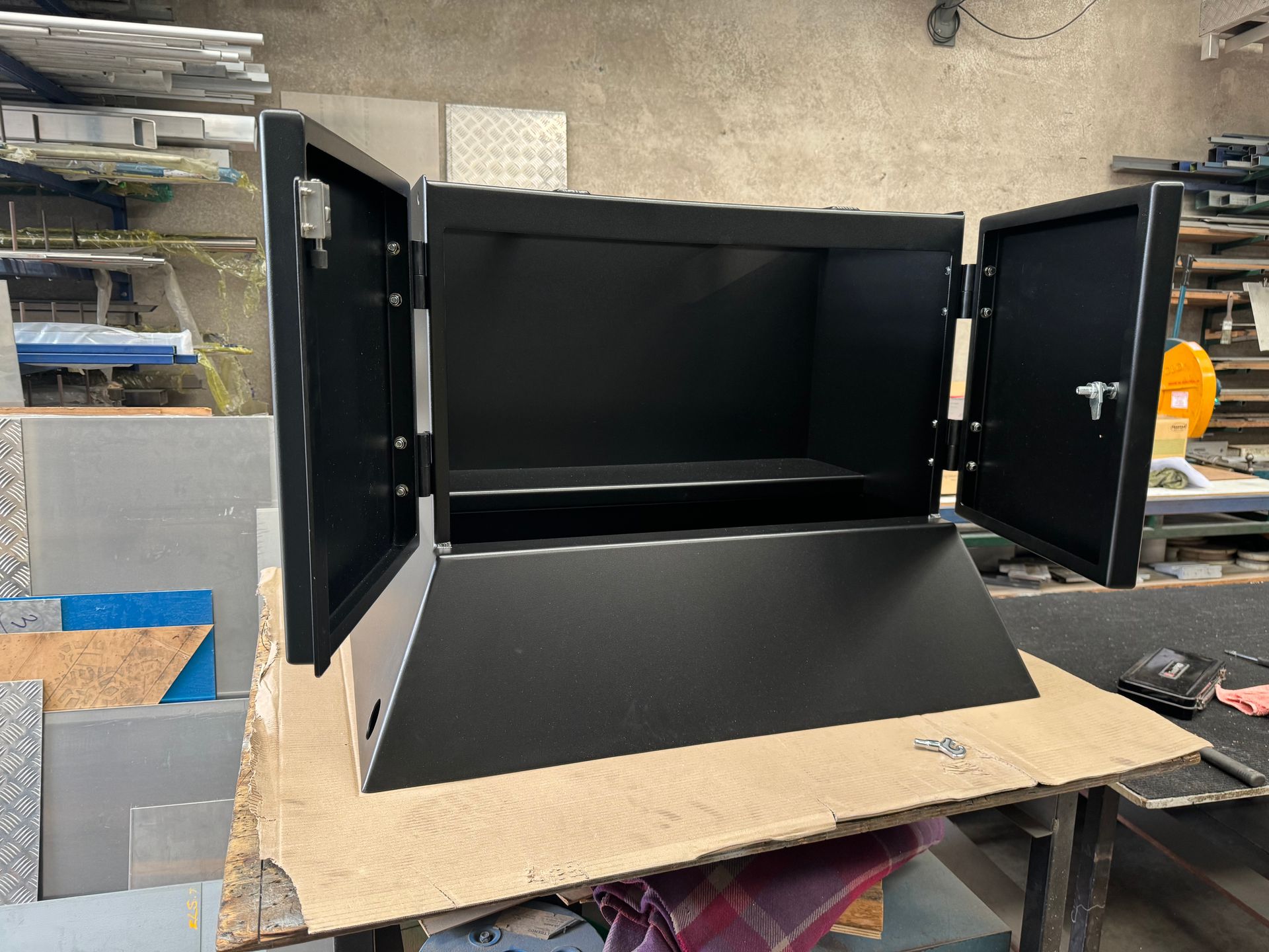 A Large Stainless Steel Table is Sitting in a Warehouse — Metaltrendz in Maroochydore, QLD