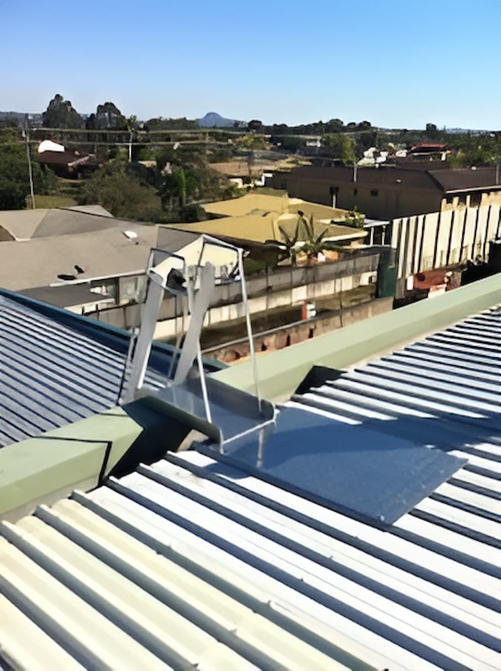 A Ladder is Attached to the Roof of a Building — Metaltrendz in Kunda Park, QLD