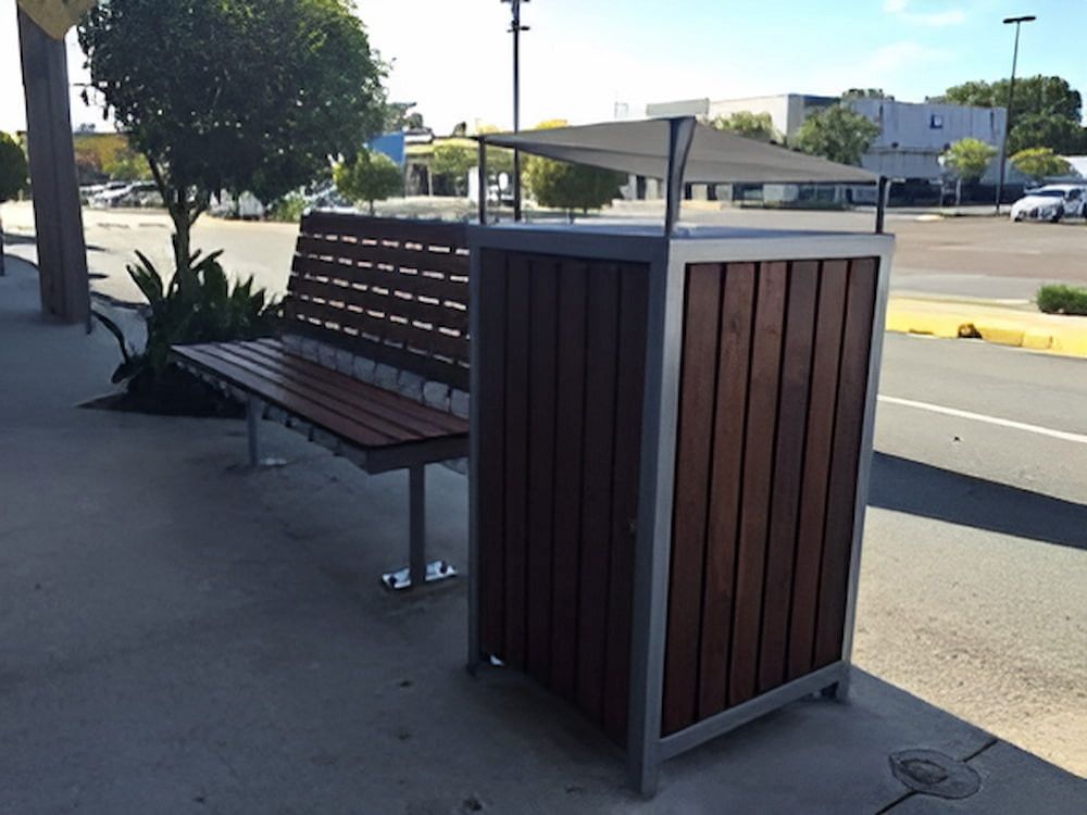 A Wooden Bench Sits Next to a Wooden Trash Can — Metaltrendz in Kunda Park, QLD