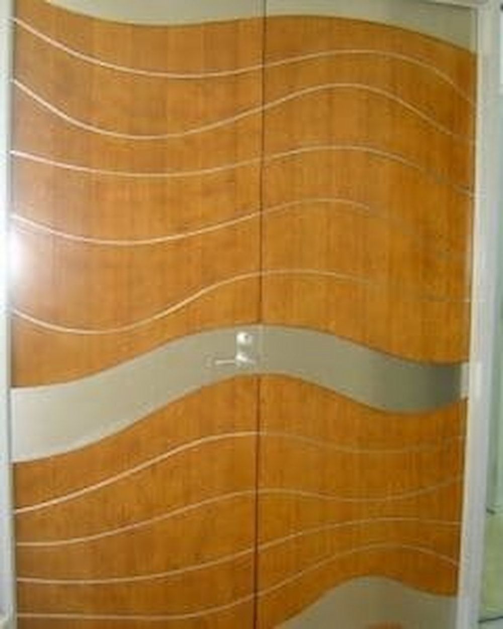 A Wooden Door With a Wave Design on It — Metaltrendz in Kunda Park, QLD