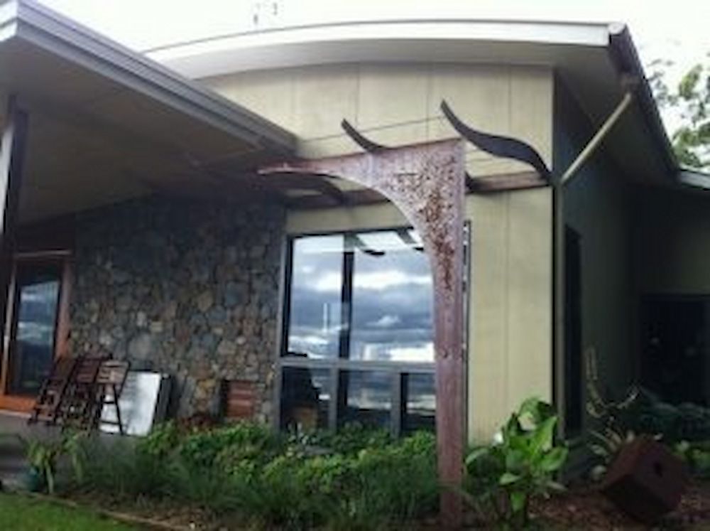 A House With a Large Window and a Sculpture in Front of It — Metaltrendz in Kunda Park, QLD