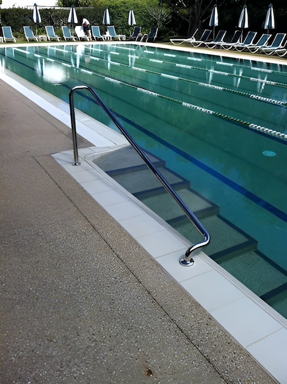 A Large Swimming Pool With Stairs Leading to It — Metaltrendz in Kunda Park, QLD