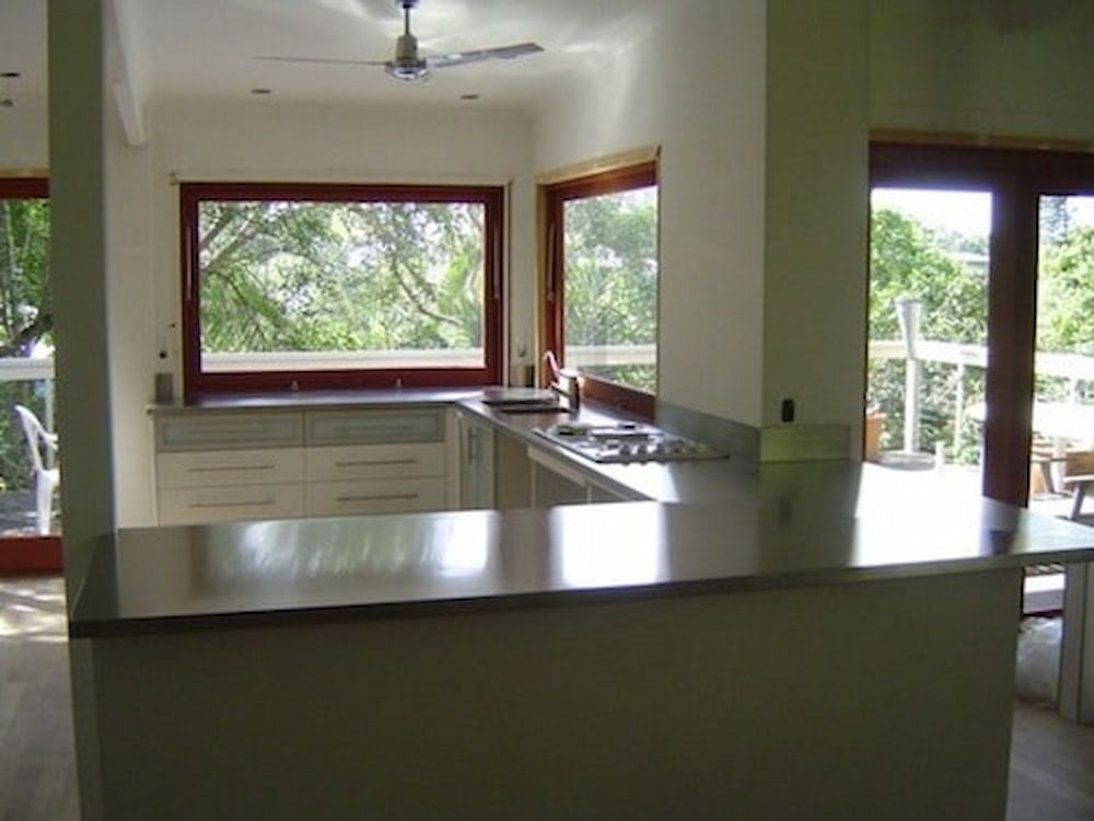 A Kitchen With Stainless Steel Counter Tops and a Large Window — Metaltrendz in Kunda Park, QLD